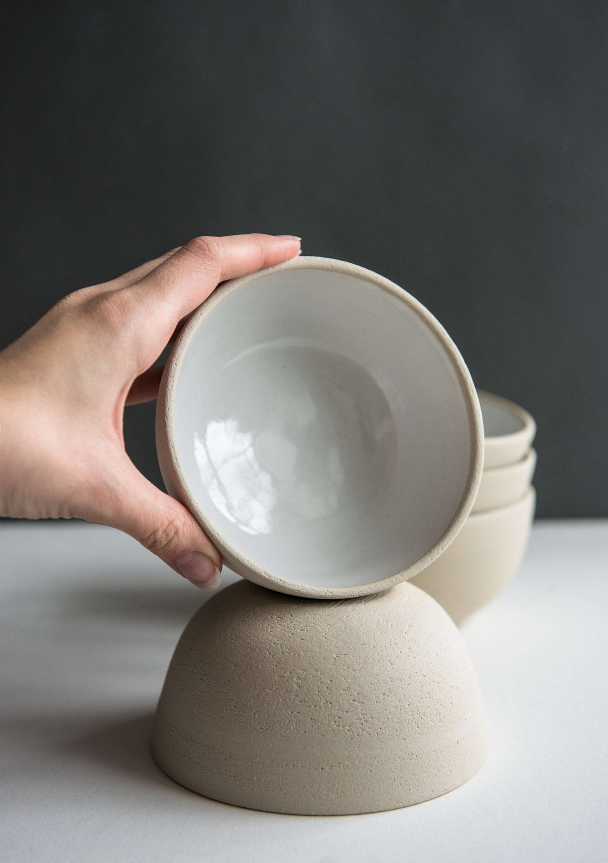 Handmade stoneware small bowl with textured exterior and smooth white glazed interior, dishwasher safe and food-safe, crafted in Ukraine