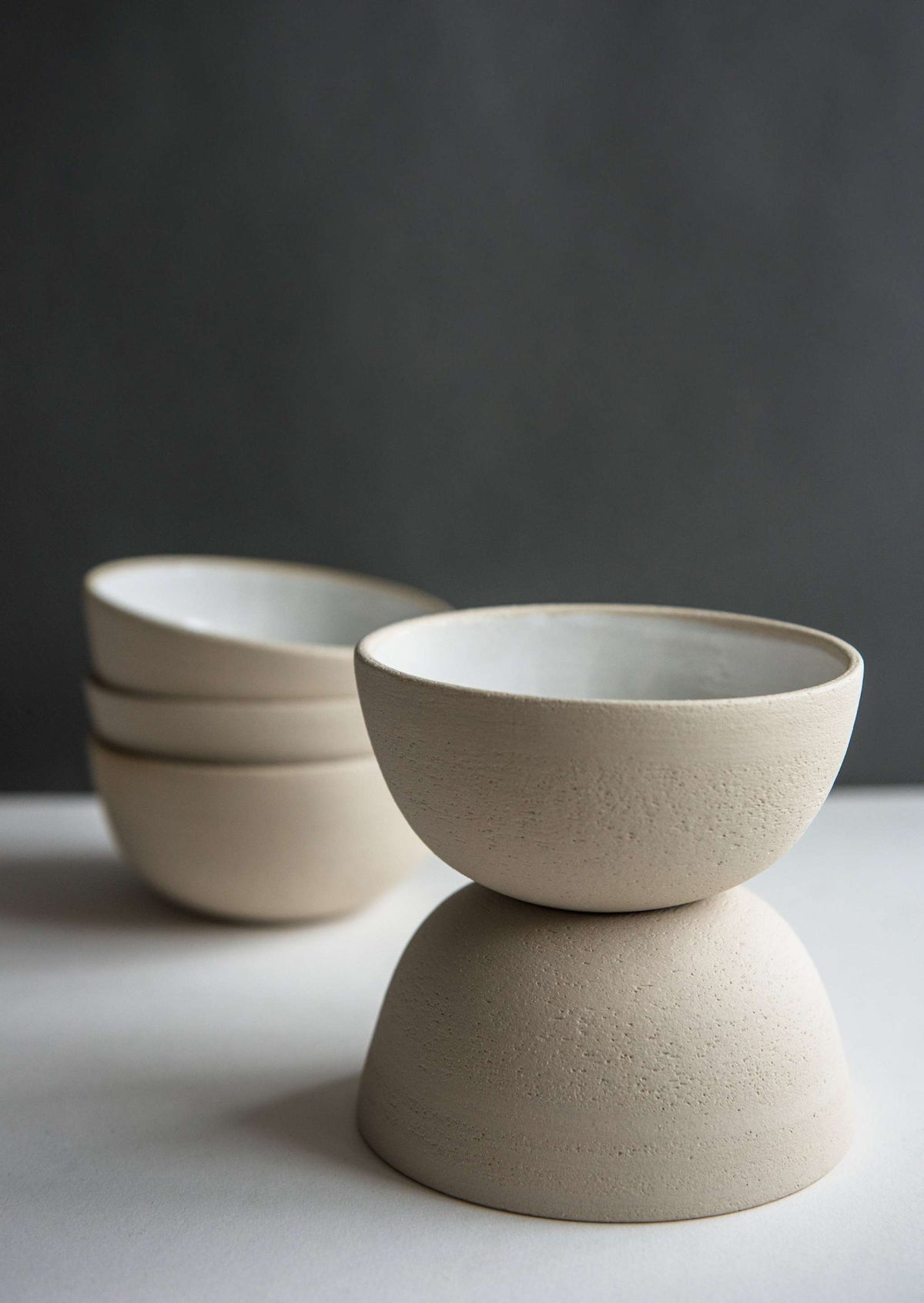 Handmade stoneware small bowl with textured exterior and smooth white glaze interior