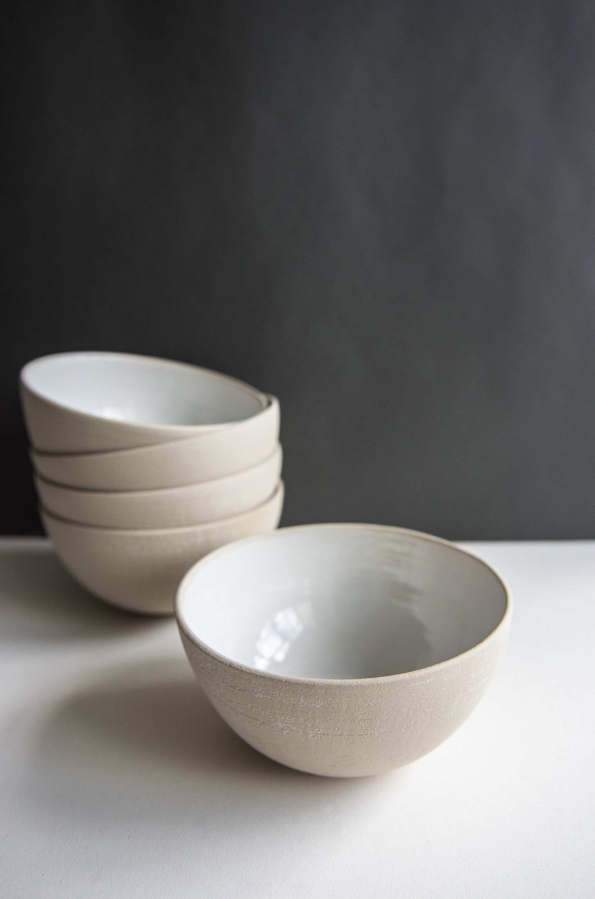 Handmade stoneware soup bowl with white glaze, rustic texture, and food-safe finish