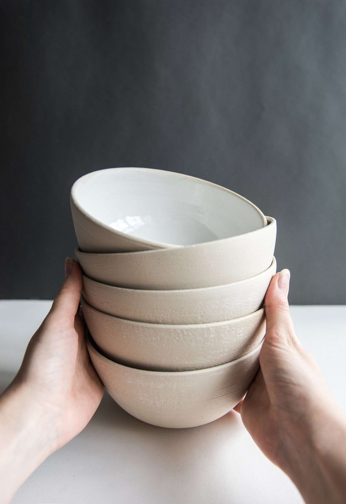 Handmade stoneware soup bowl with white glaze, rough textured exterior, dishwasher and microwave safe, crafted in Ukraine