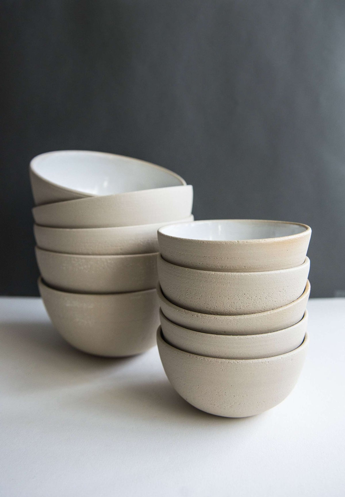 Handmade stoneware small bowl with textured exterior and smooth white glaze interior