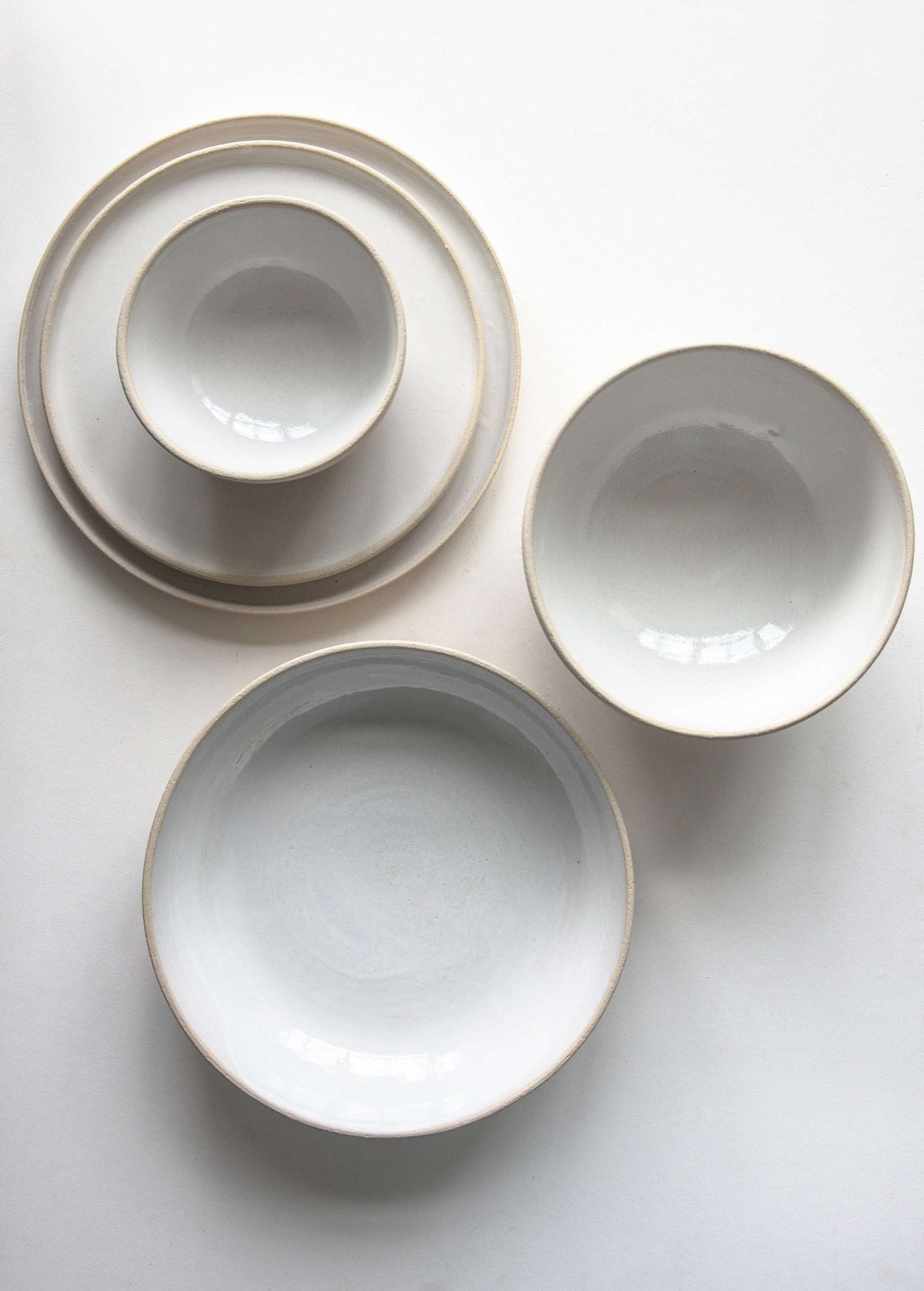 Handmade stoneware soup bowl with white glaze, rustic texture, and porous surface, made in Ukraine