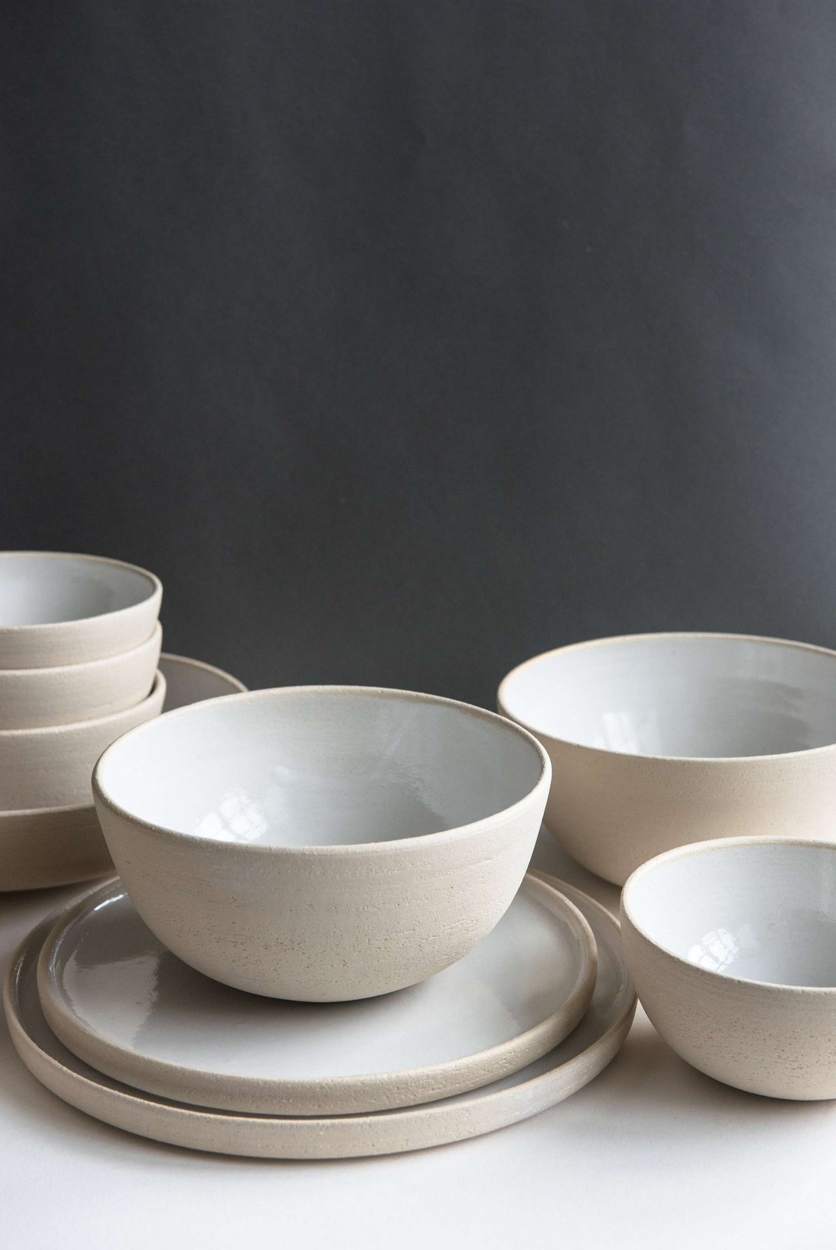 Handmade stoneware soup bowl with white glaze and exposed textured surface