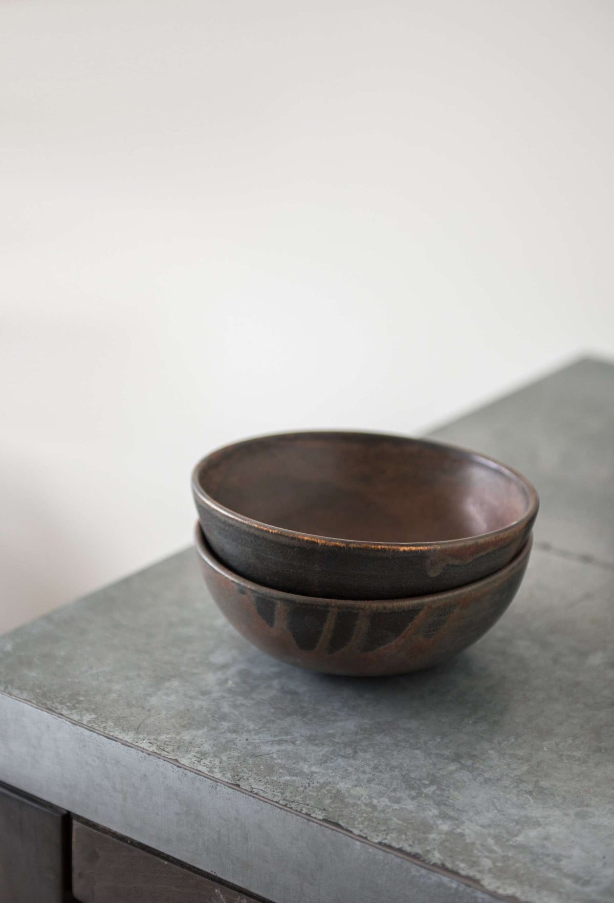 Matte brown-black rust stoneware soup bowl with unique reactive glaze swirl, handmade in Ukraine