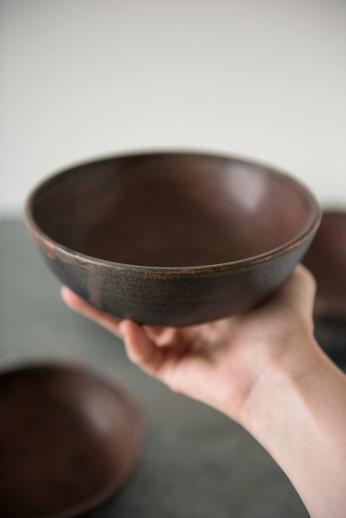 Matte brown-black Rust Stoneware Soup Bowl with unique reactive glaze swirl, handmade in Ukraine, dishwasher and microwave safe
