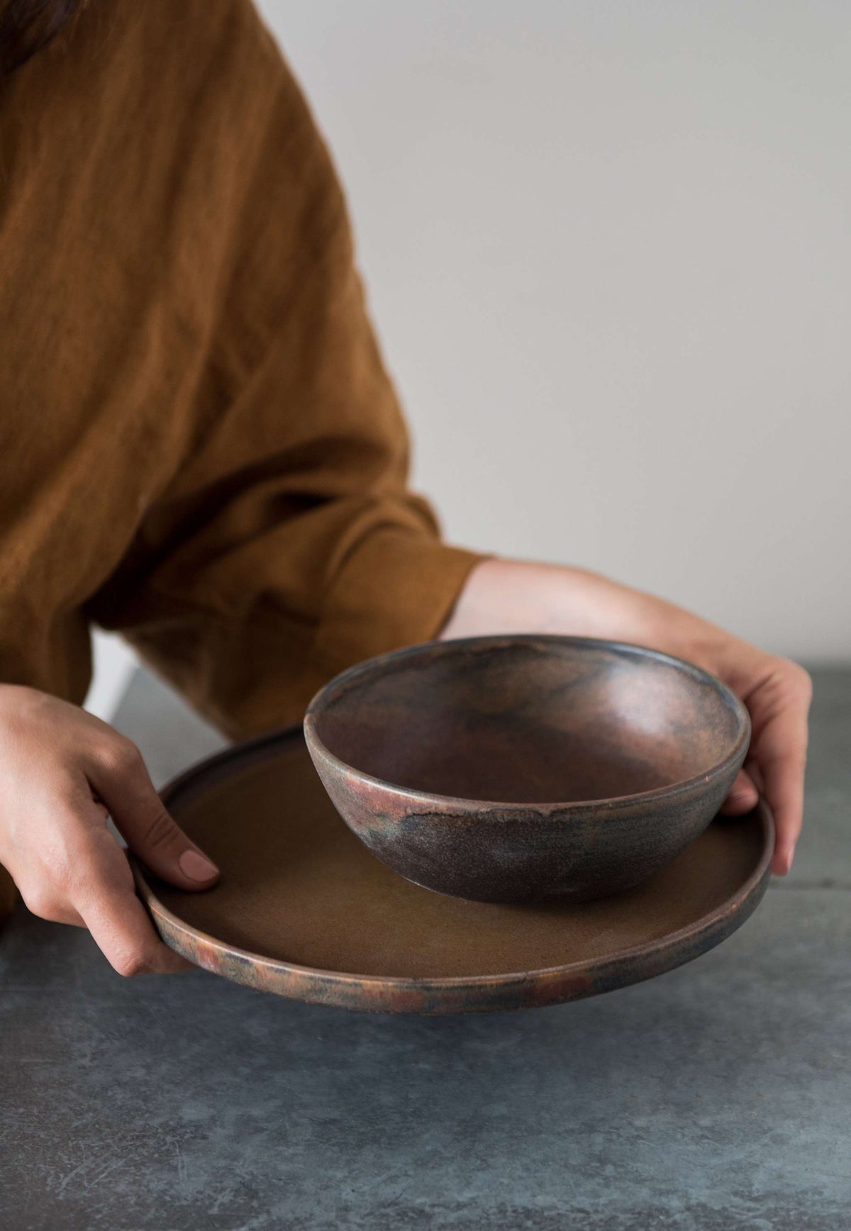 Rust stoneware soup bowl with matte brown-black reactive glaze, handmade in Ukraine, dishwasher and microwave safe