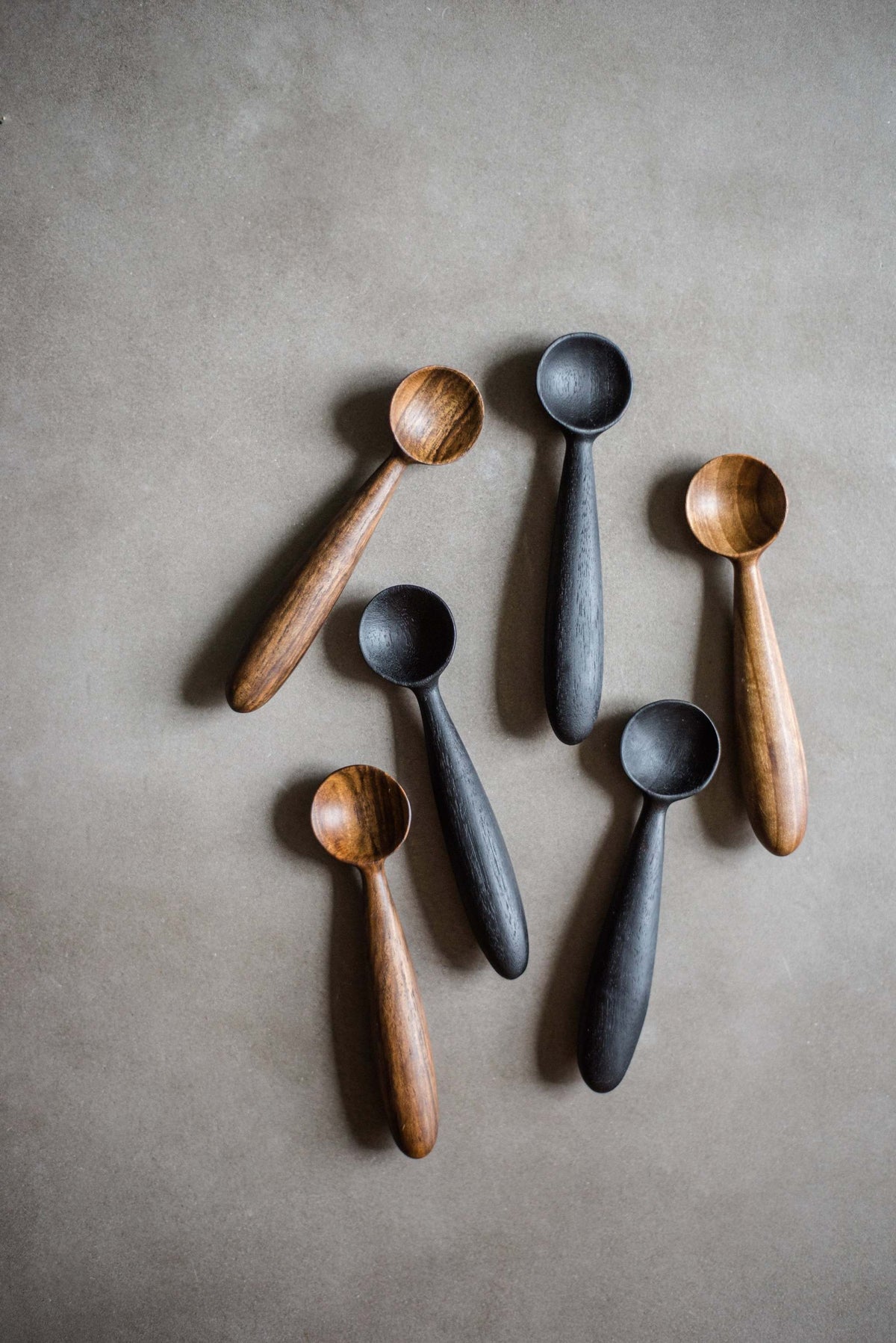 Hand-carved walnut wood spice spoon with food-safe flaxseed oil finish for kitchen use