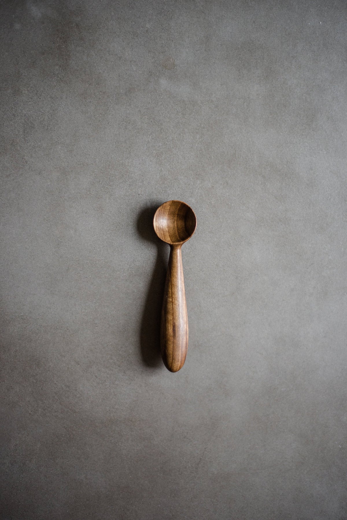 Hand-carved walnut wood spice spoon with natural flaxseed oil finish for kitchen use, made in Ukraine