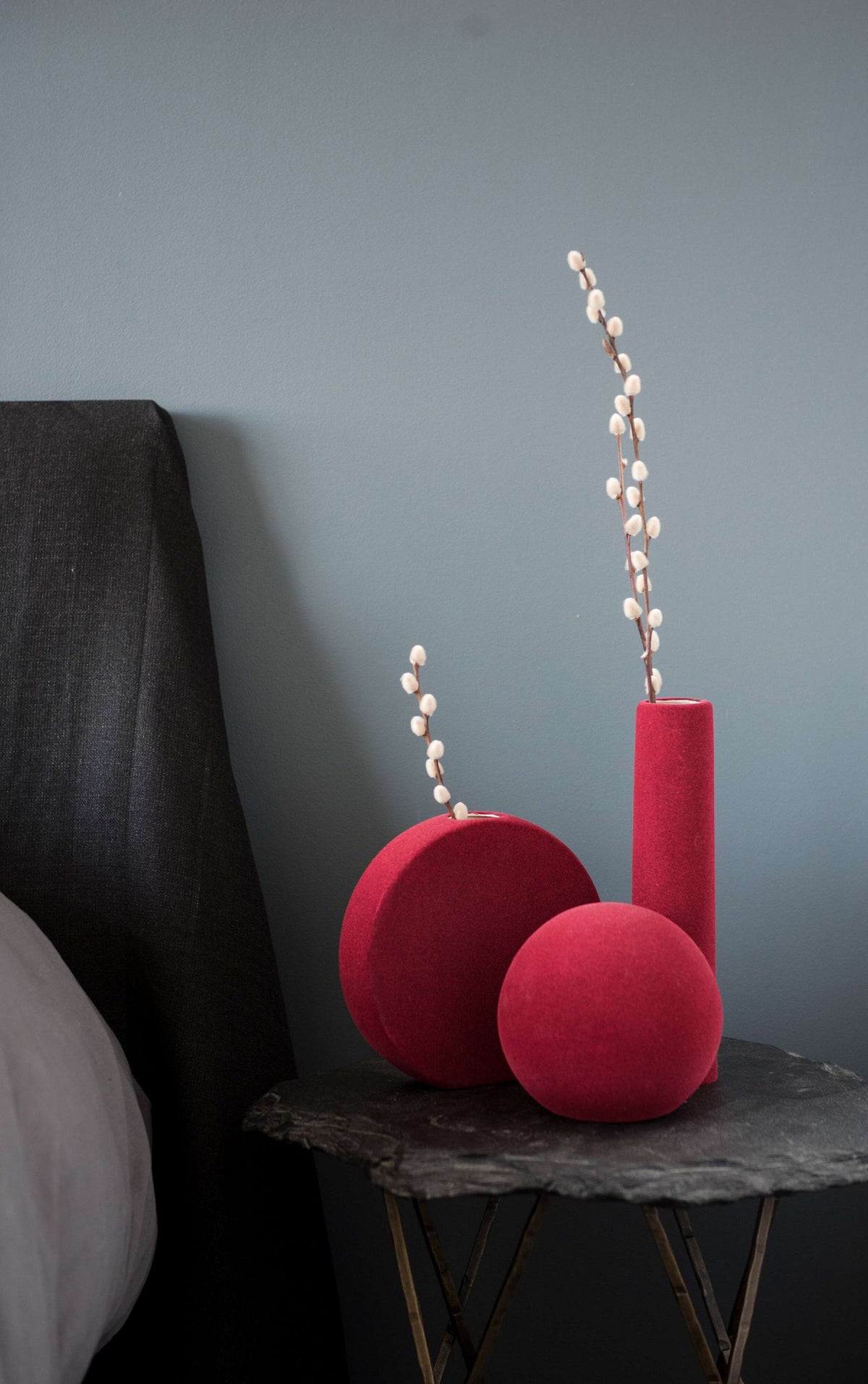 Porcelain set of home decor geometric objects with burgundy tube vase