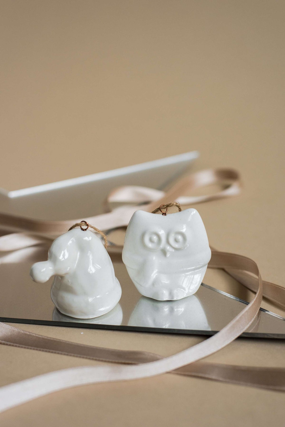 White handmade porcelain Christmas ornaments with rustic jute loops, made in Ukraine, ideal for holiday decor