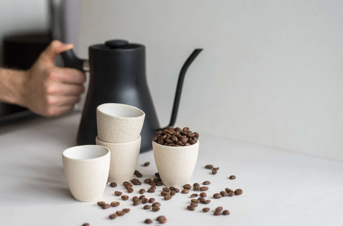 Handmade stoneware espresso cup with exposed clay exterior and white glazed interior, dishwasher safe, made in Ukraine