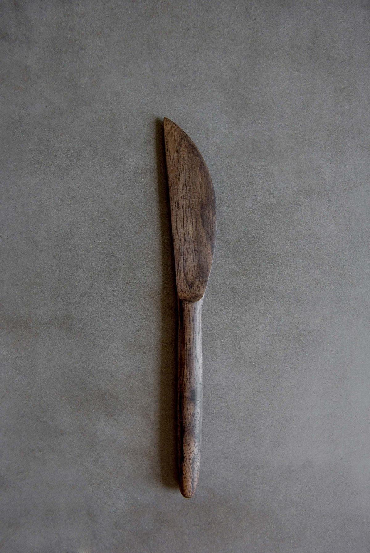 Handcrafted walnut wood knife by Ukrainian artist Vladislav Gorbachov, polished with flaxseed oil, ideal for everyday use.