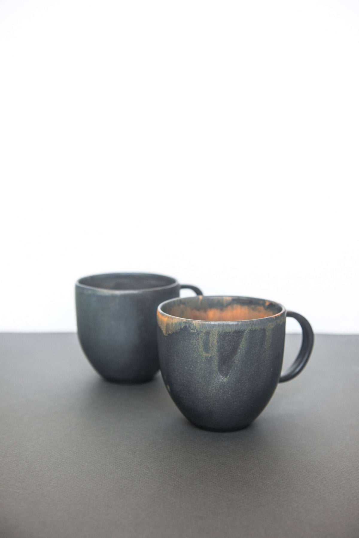 Rust stoneware coffee mug with handle and unique reactive glaze, handmade in Ukraine