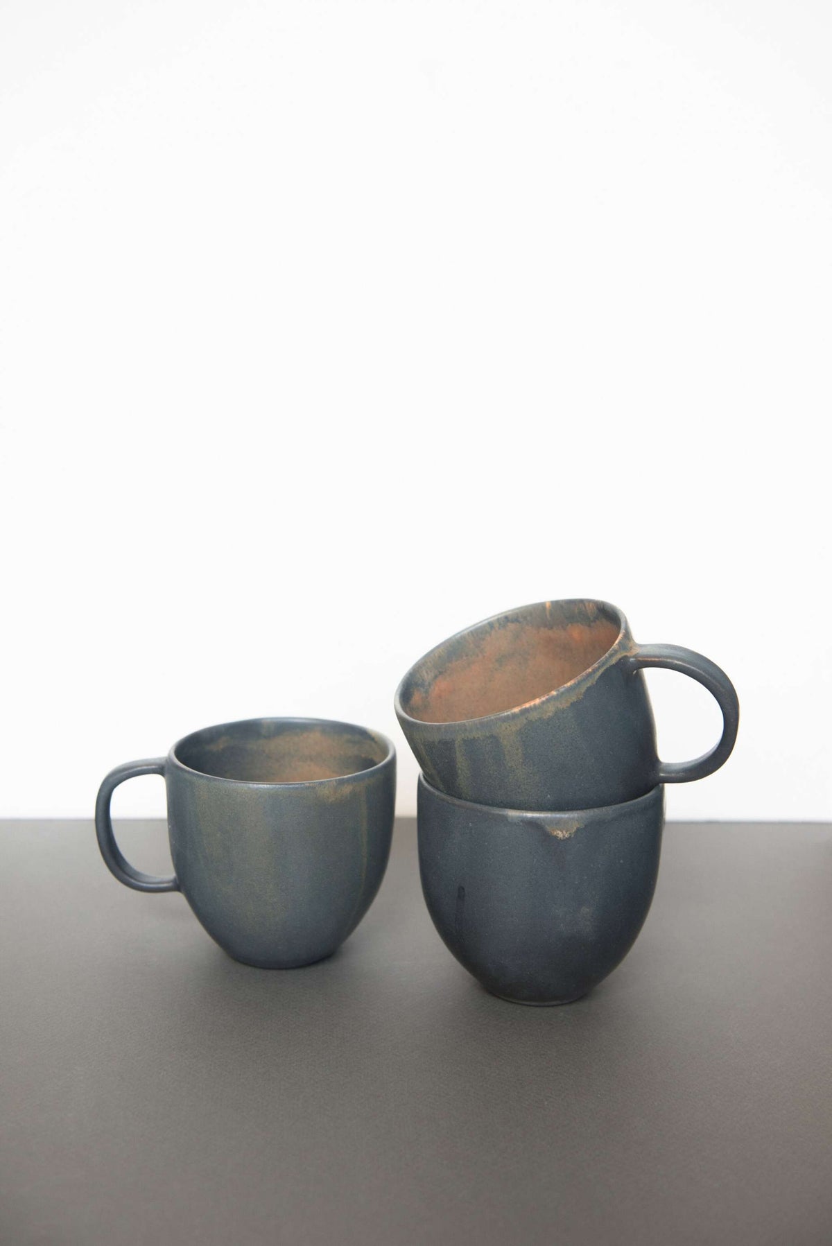Rust stoneware coffee mug with handle and unique reactive glaze, handmade in Ukraine