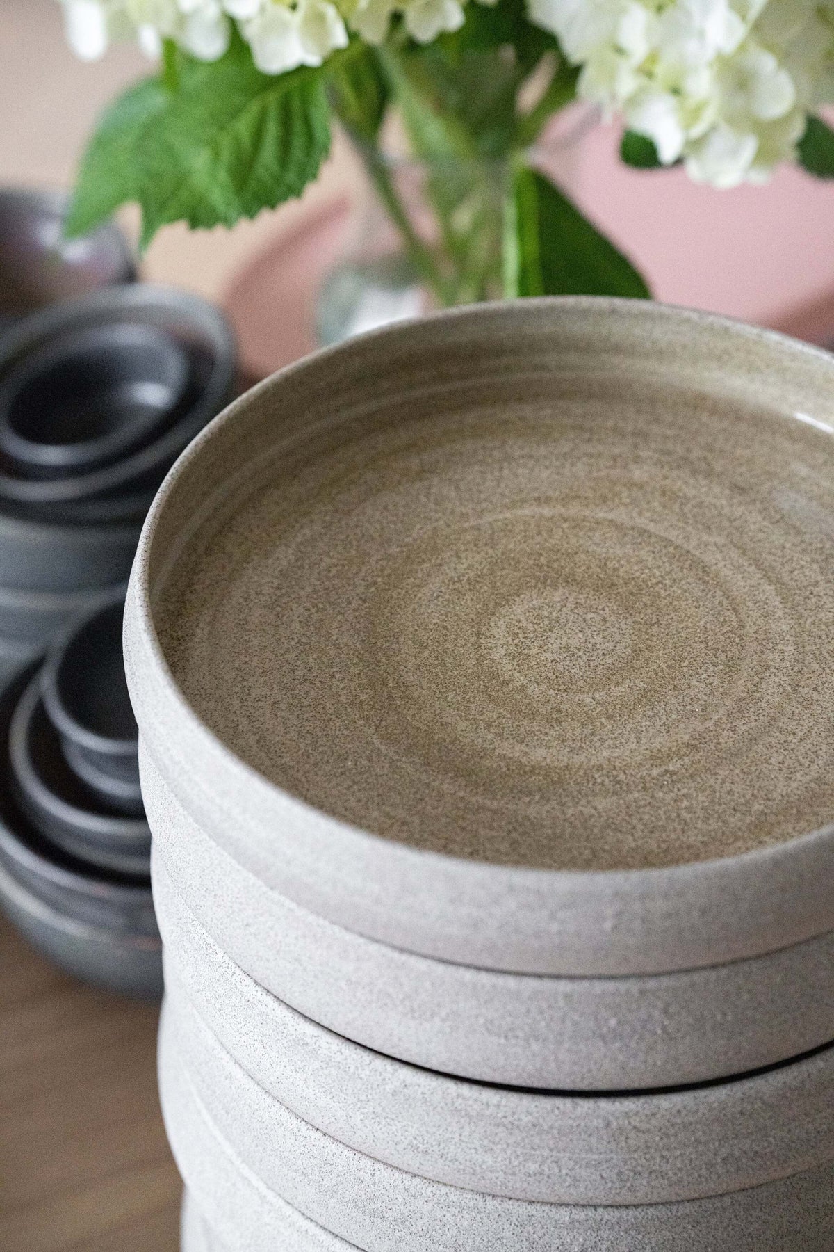 Handmade stoneware dinner plate with high sides in concrete style, glossy inside and rough outside texture