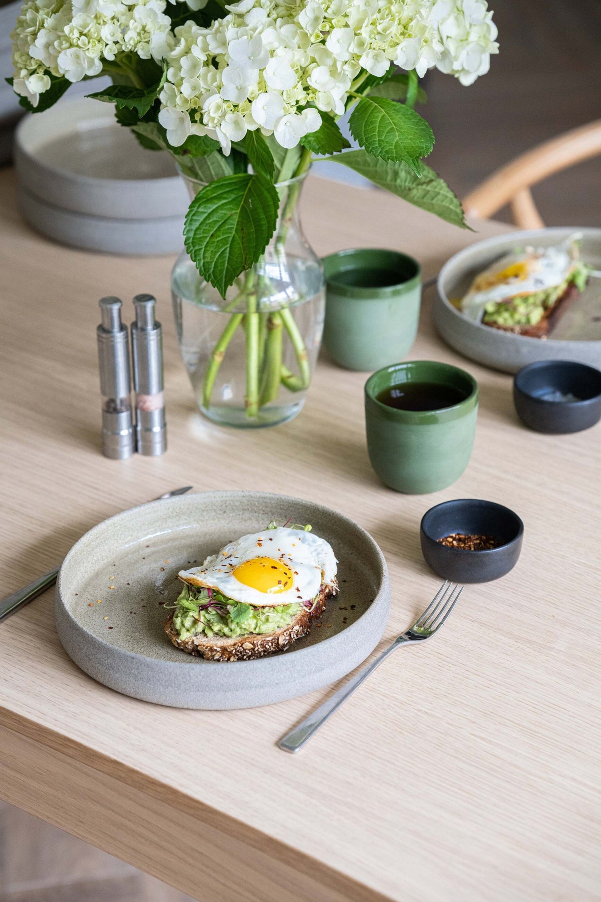 Handmade stoneware dinner plate with high sides in concrete style, glossy interior and rustic exterior