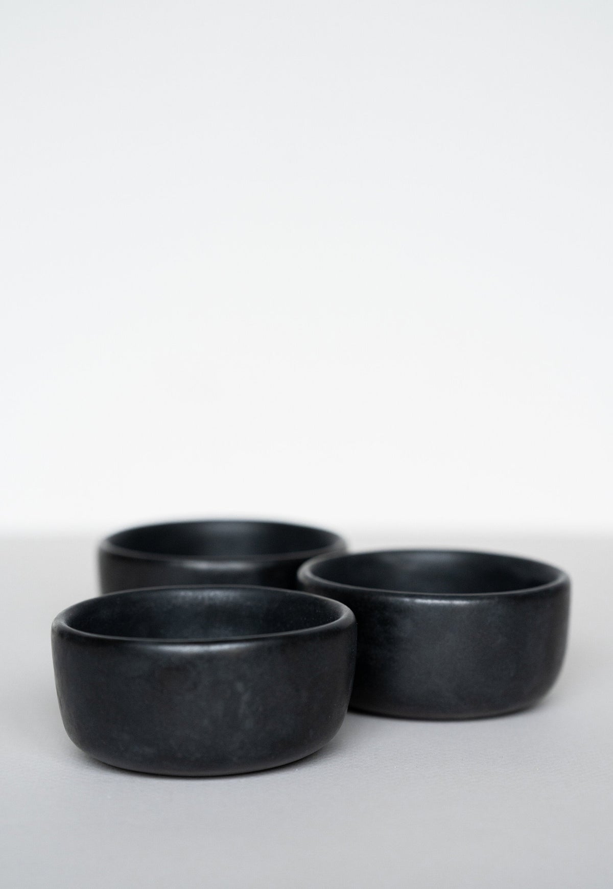 Black matte stoneware pinch bowl handmade in Ukraine with food-safe glaze