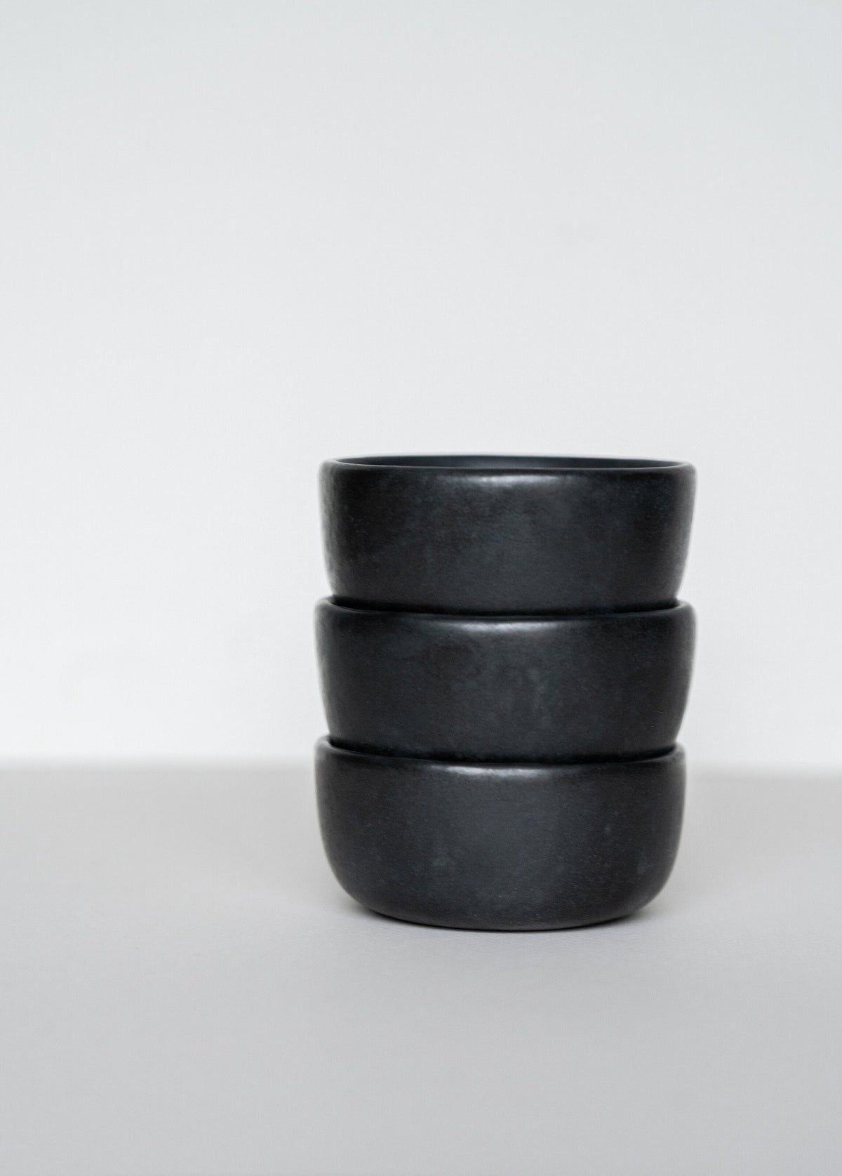 Black matte stoneware pinch bowl handcrafted in Ukraine, dishwasher and microwave safe, unique deep sauce bowl for condiments