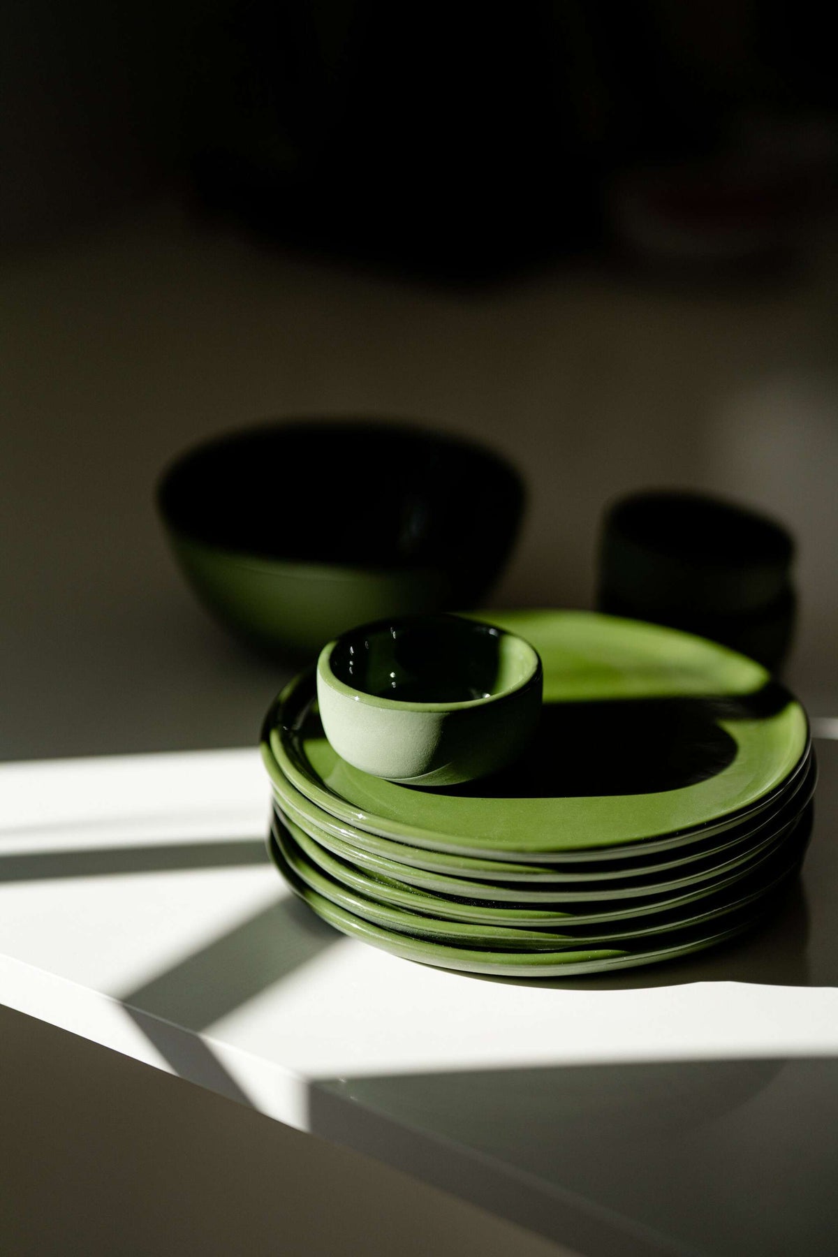 Handmade green porcelain dinner and salad plates with shiny glaze, made in Ukraine