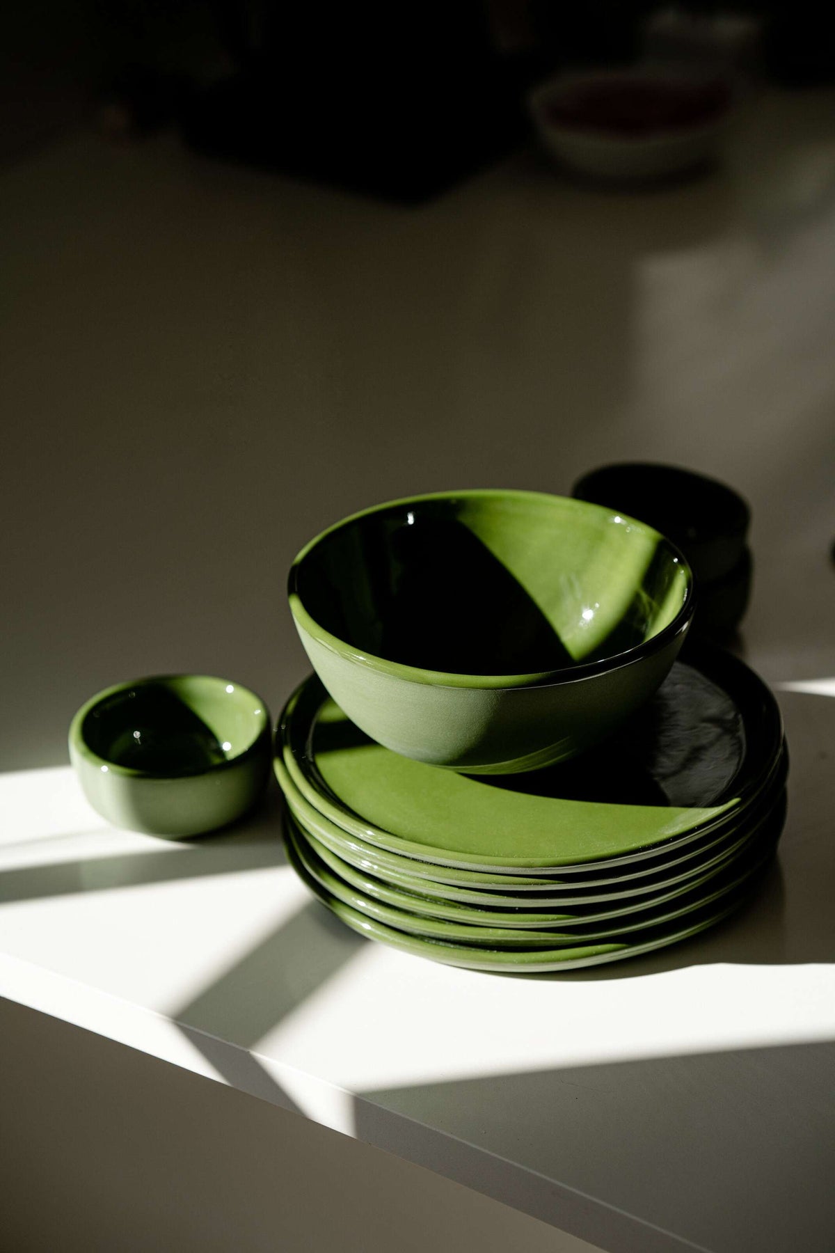 Set of handmade porcelain dinner plates in green with shiny glaze, includes dinner and salad plates, made in Ukraine