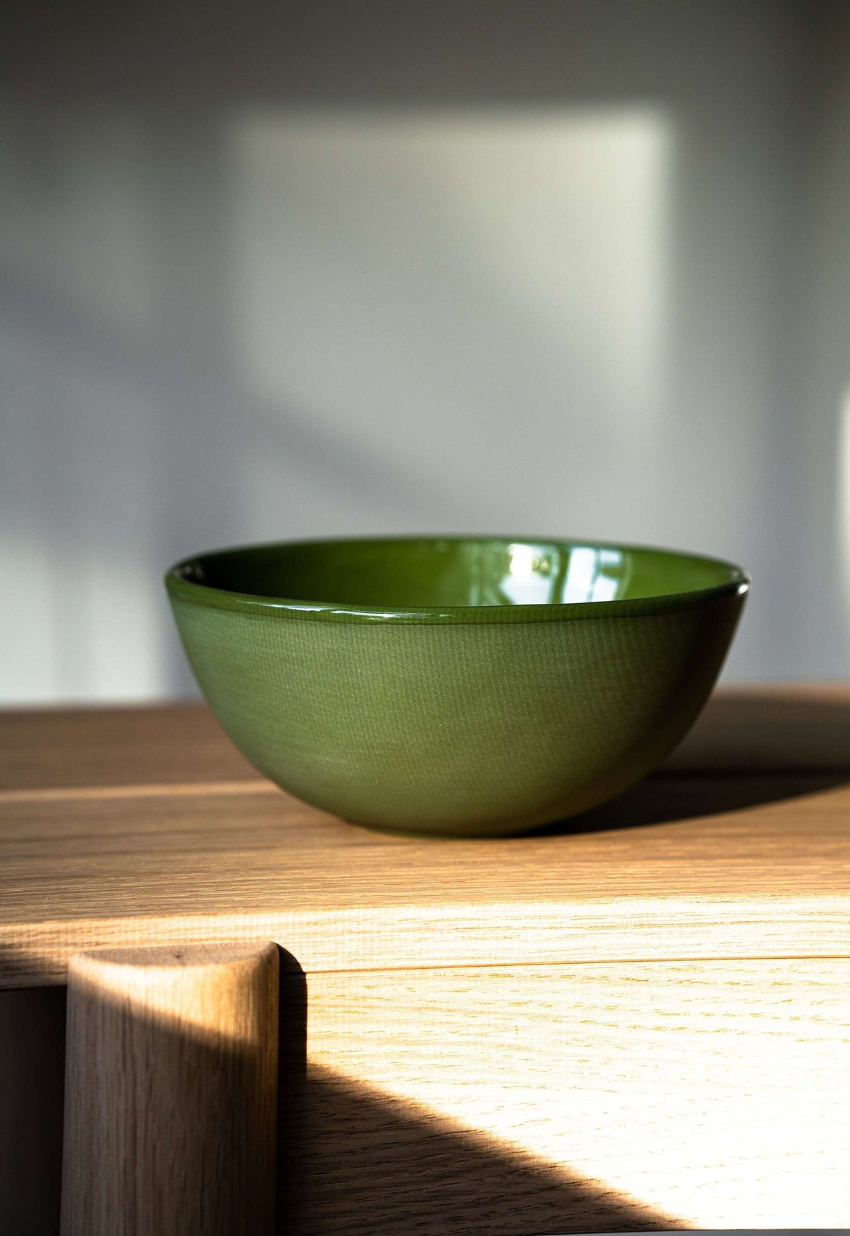 Handmade green porcelain bowl with shiny glaze, food-safe and lead-free, made in Ukraine