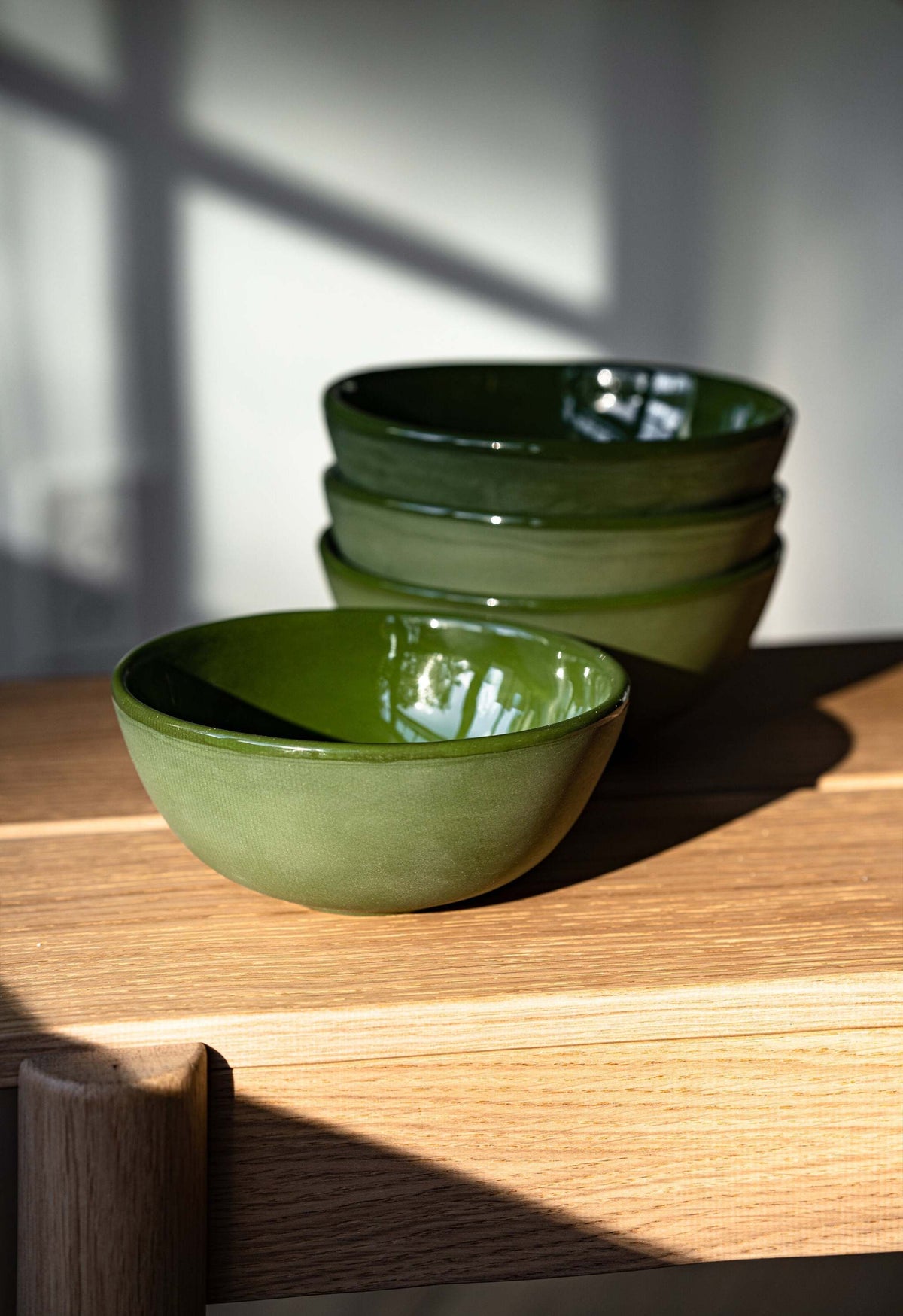 Handmade green porcelain bowl with shiny glaze, smooth exterior, food-safe and lead-free, made in Ukraine