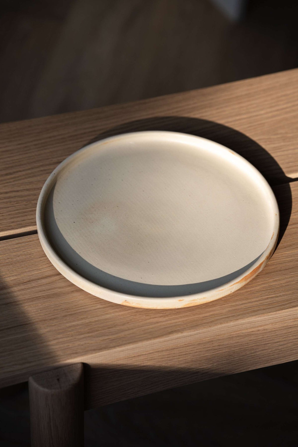 Beige matte stoneware dinner plates with unique reactive glaze, handmade in Ukraine, dishwasher and microwave safe.