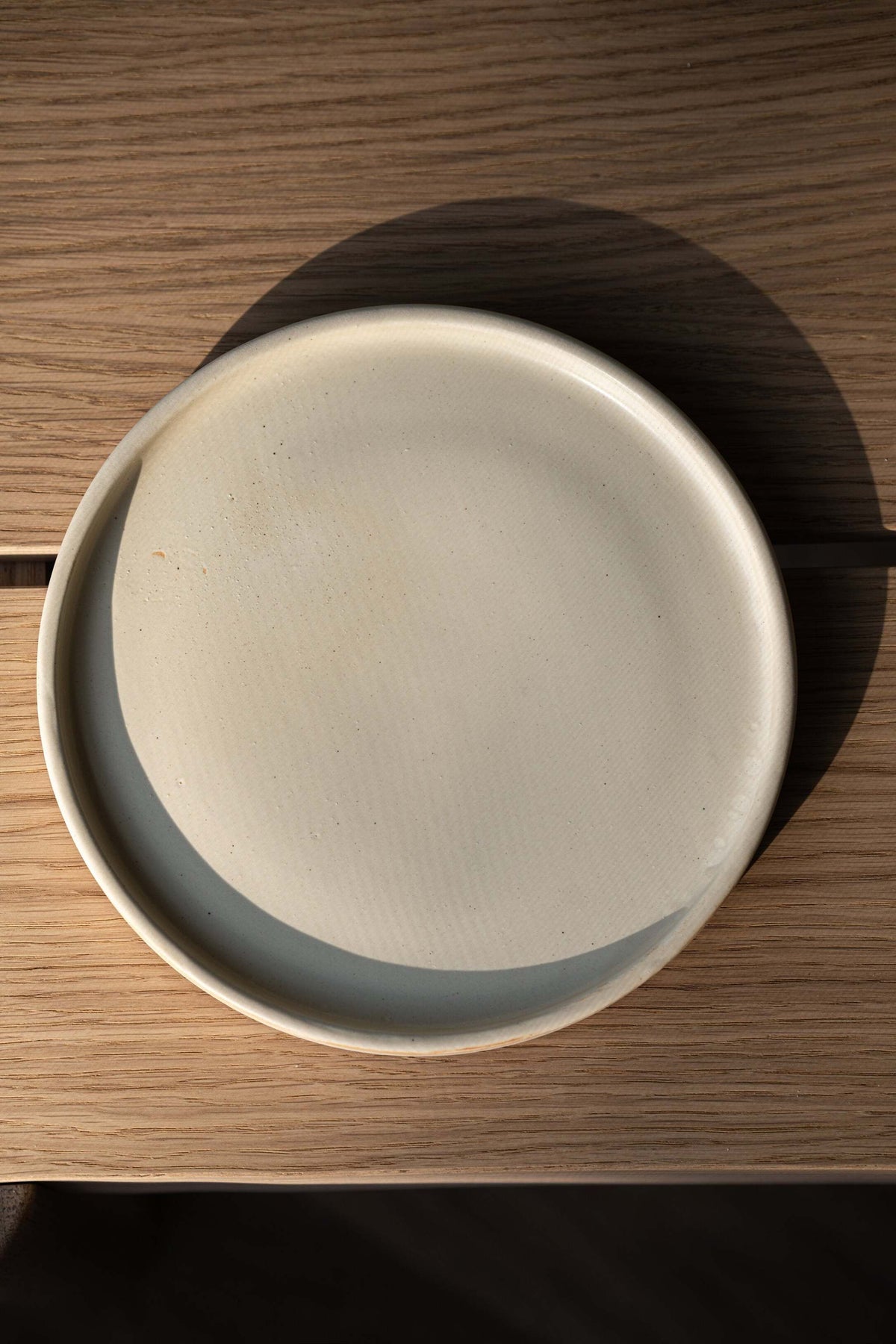 Beige matte stoneware dinner plates with unique reactive glaze, handmade in Ukraine