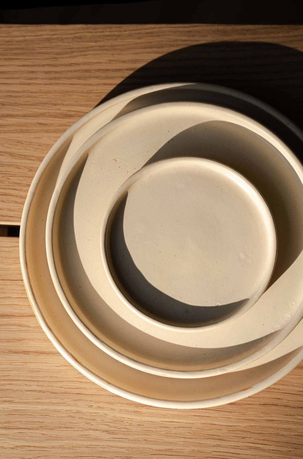Beige matte stoneware dinner plates with unique reactive glaze, handcrafted in Ukraine, dishwasher and microwave safe
