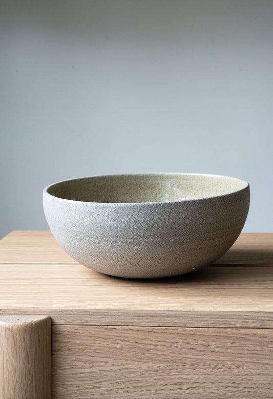 Handmade stoneware ramen bowl with concrete-like texture and glossy interior glaze