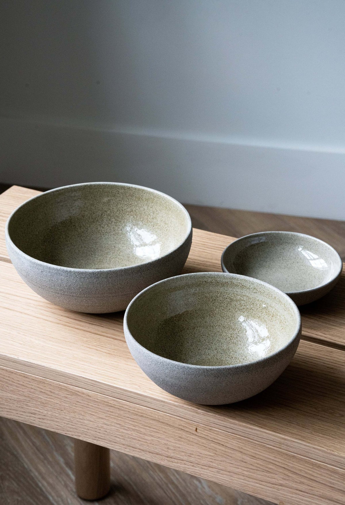 Stoneware nesting bowl set "Concrete" with rough exterior and glossy interior, handmade in Ukraine, includes three sizes.