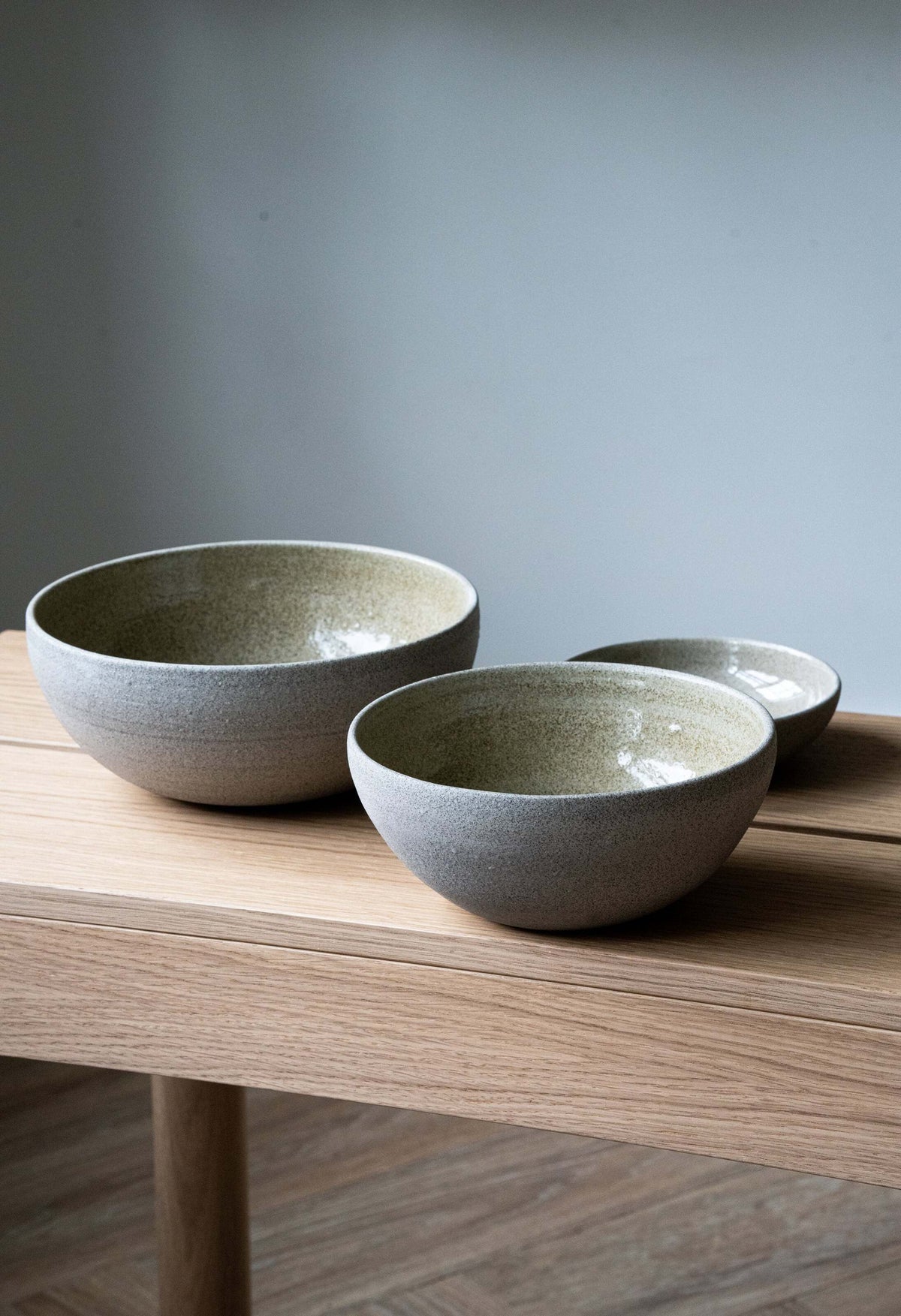 Stoneware nesting bowl set with concrete texture, polished exterior and glossy glaze interior, three handmade bowls in varying sizes