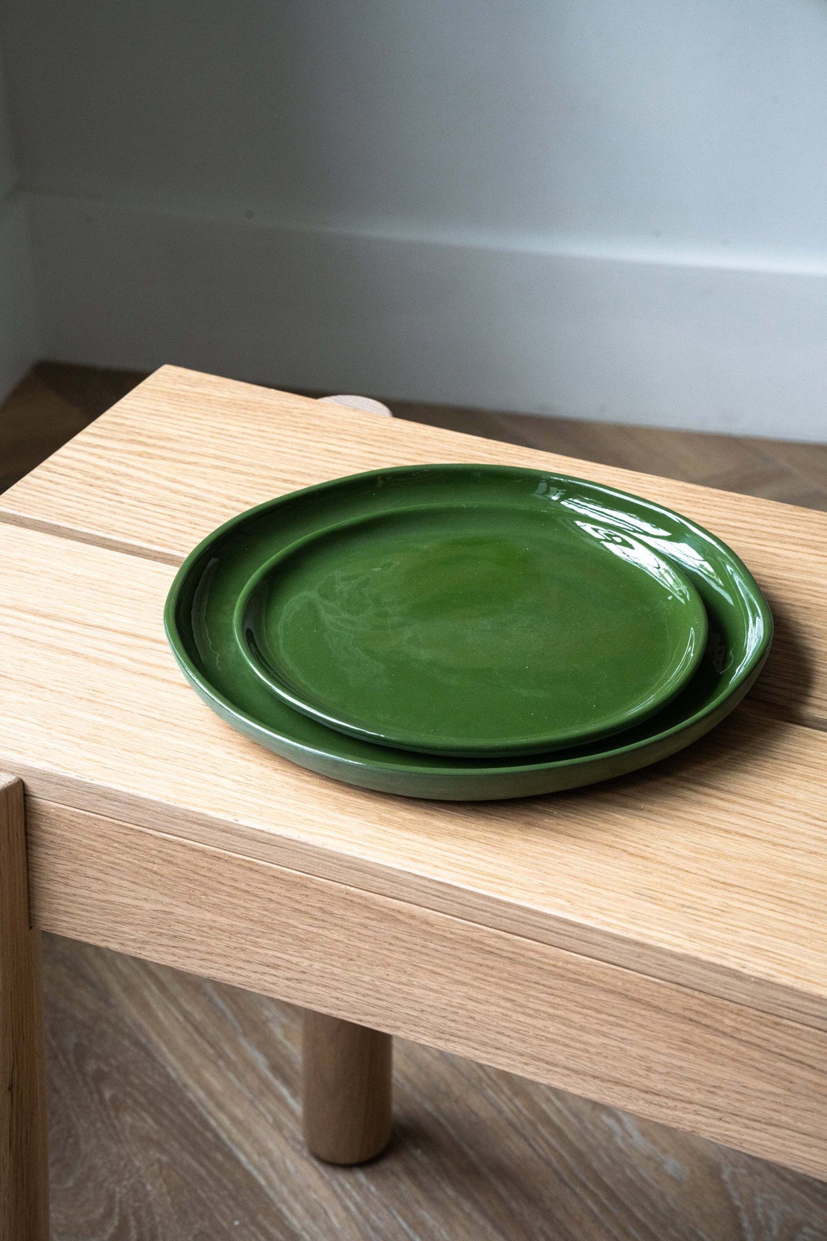 Handmade green porcelain dinner and salad plates with glossy glaze
