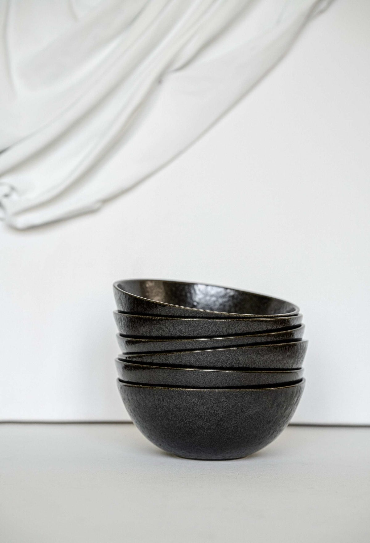 Matte black stoneware everyday bowl with glossy speckles, handmade and food-safe