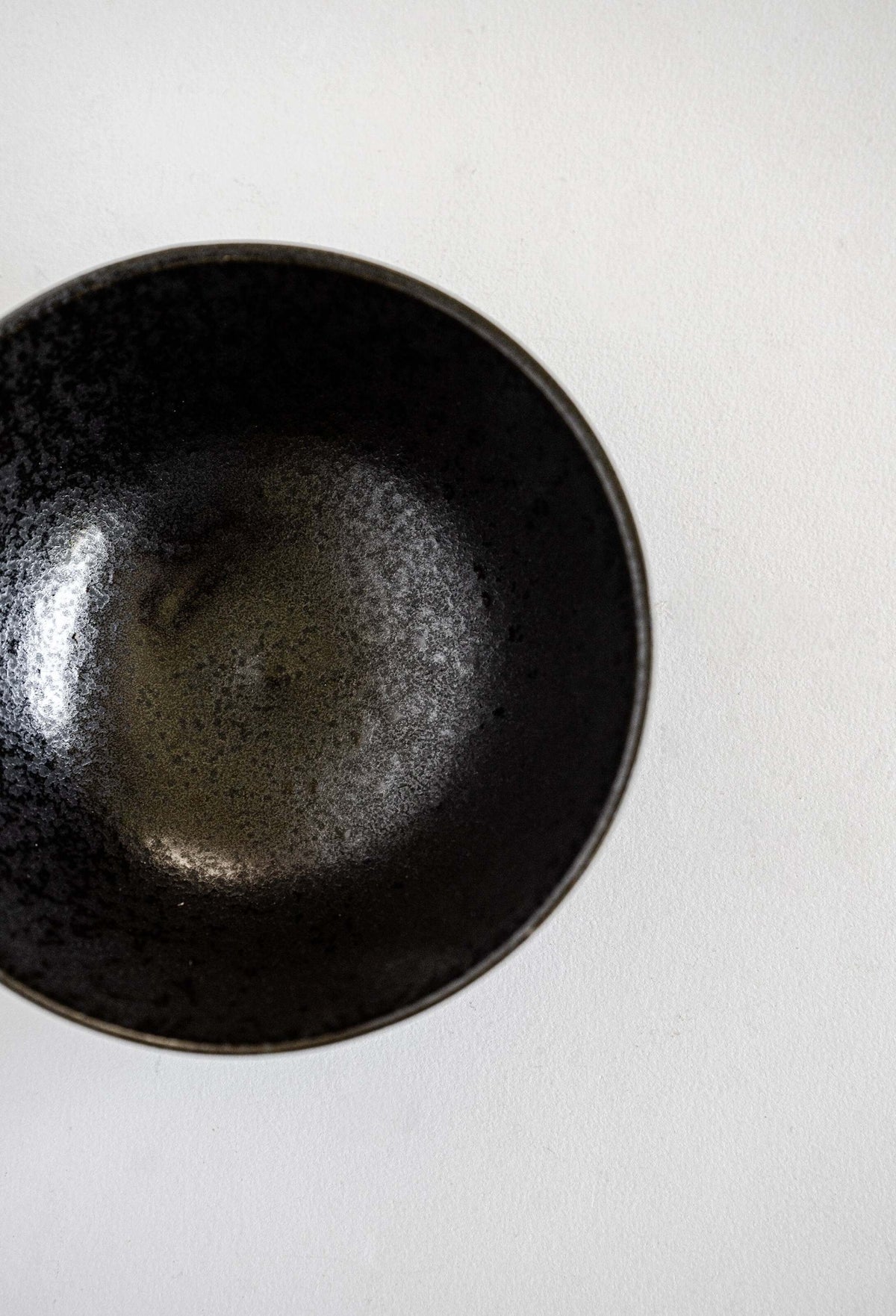 Handmade black stoneware everyday bowl with matte black glaze and glossy speckles, food-safe and durable, 5.9" diameter