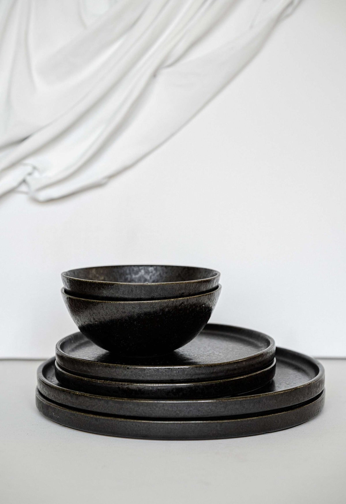Matte black stoneware everyday bowl with glossy speckles, handmade and durable, food-safe and dishwasher safe