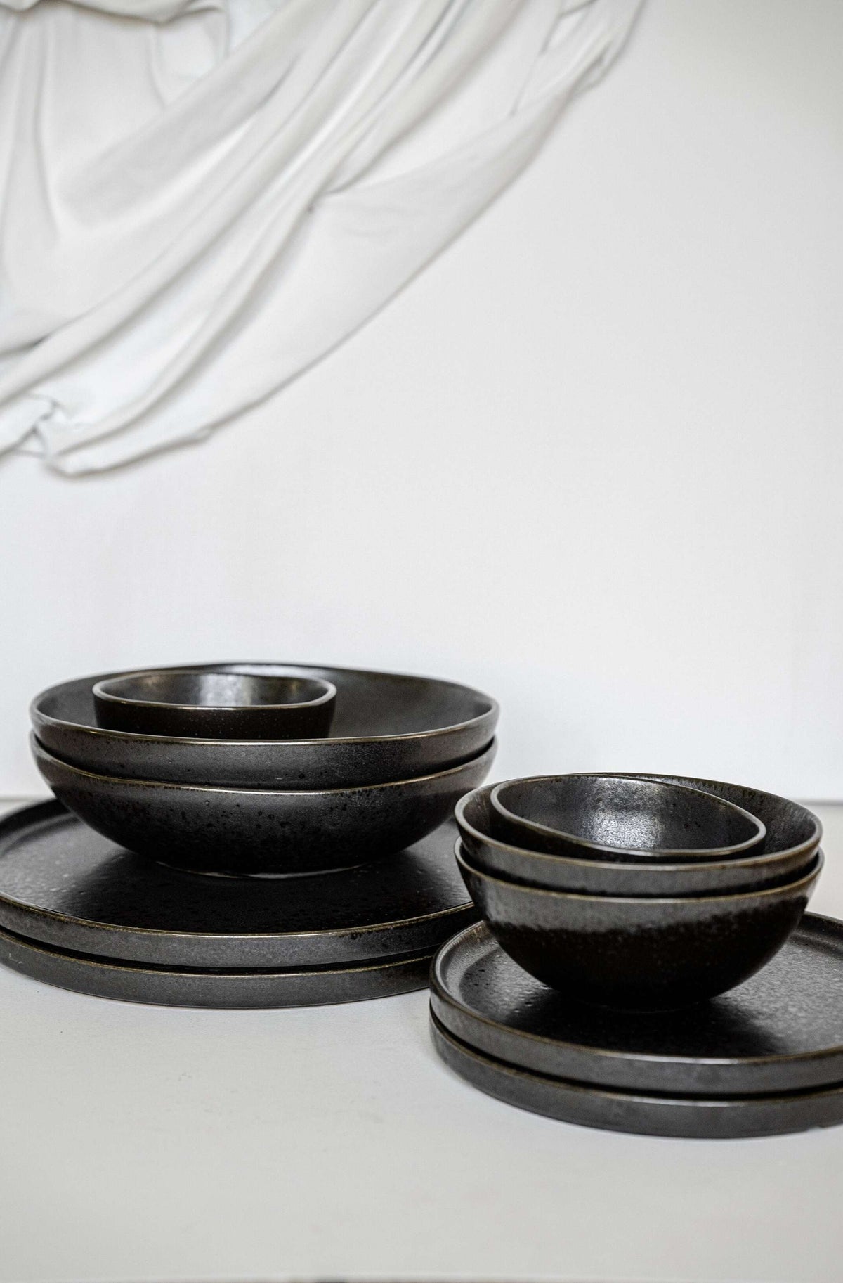 Matte black stoneware everyday bowl with glossy speckles, handmade and food-safe