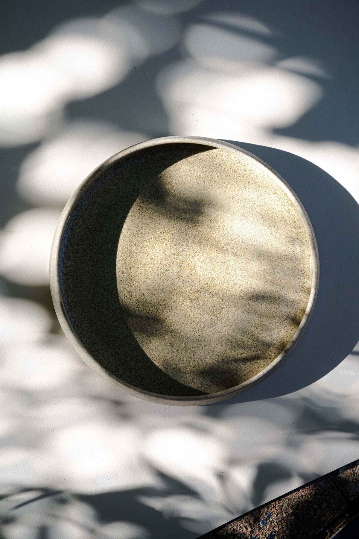 Handmade stoneware salad plate with high sides and concrete-inspired design