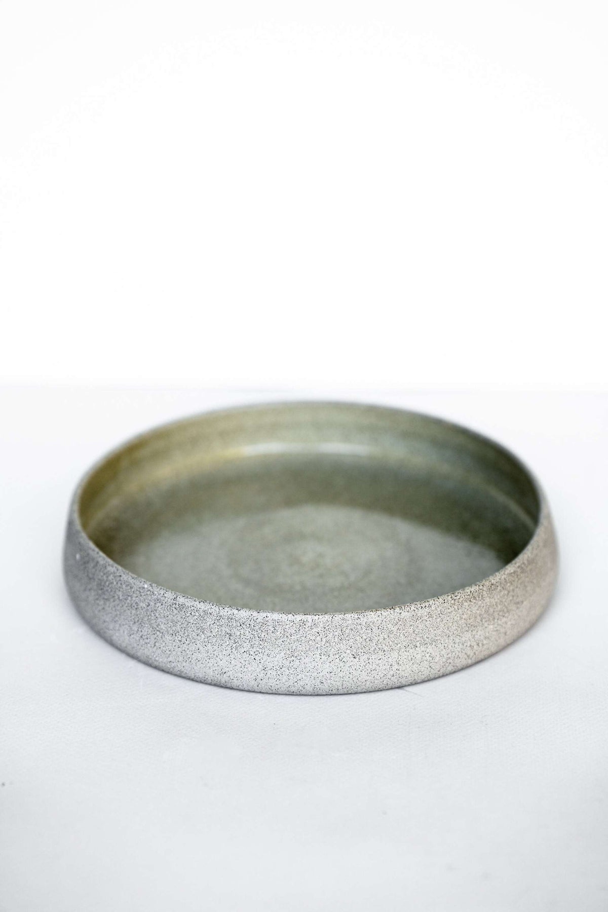 Handmade stoneware salad plate with high sides and concrete-inspired design