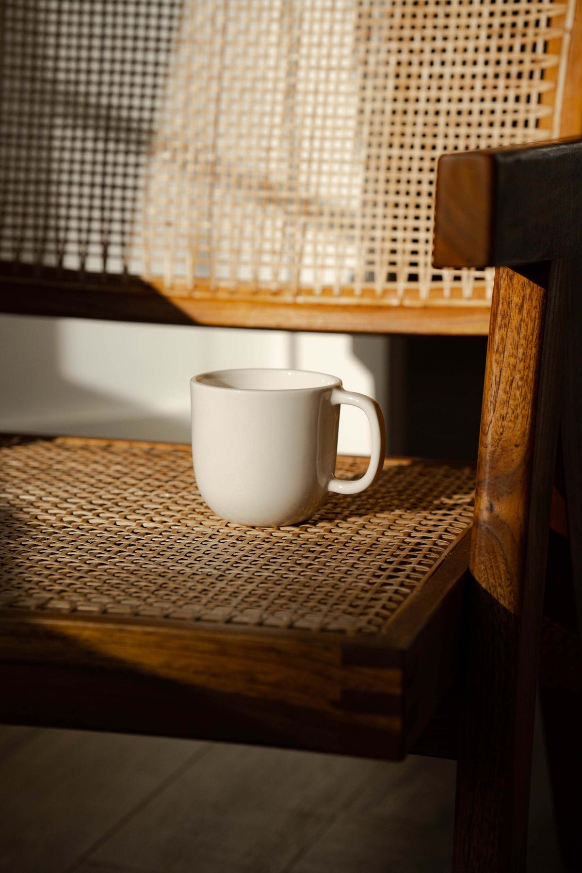 Handmade off-white porcelain coffee mug with glossy glaze, dishwasher and microwave safe, made in Ukraine