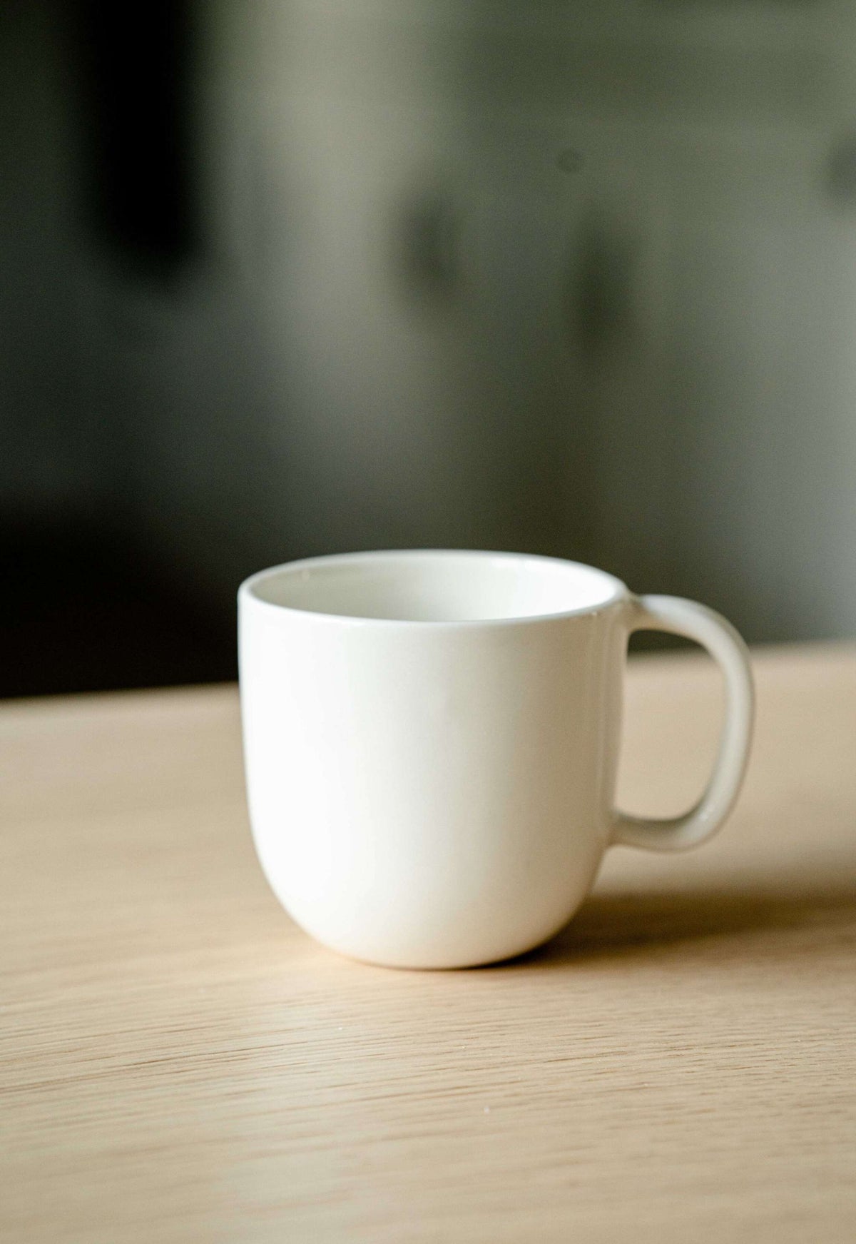Handmade off-white porcelain coffee mug with glossy food-safe glaze, dishwasher and microwave safe, made in Ukraine