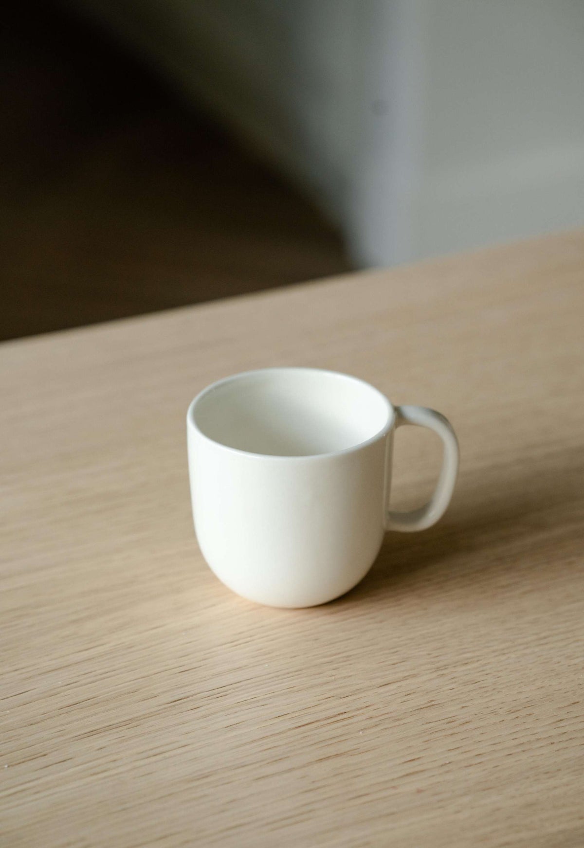 Handmade off-white porcelain coffee mug with shiny glaze, dishwasher and microwave safe, made in Ukraine
