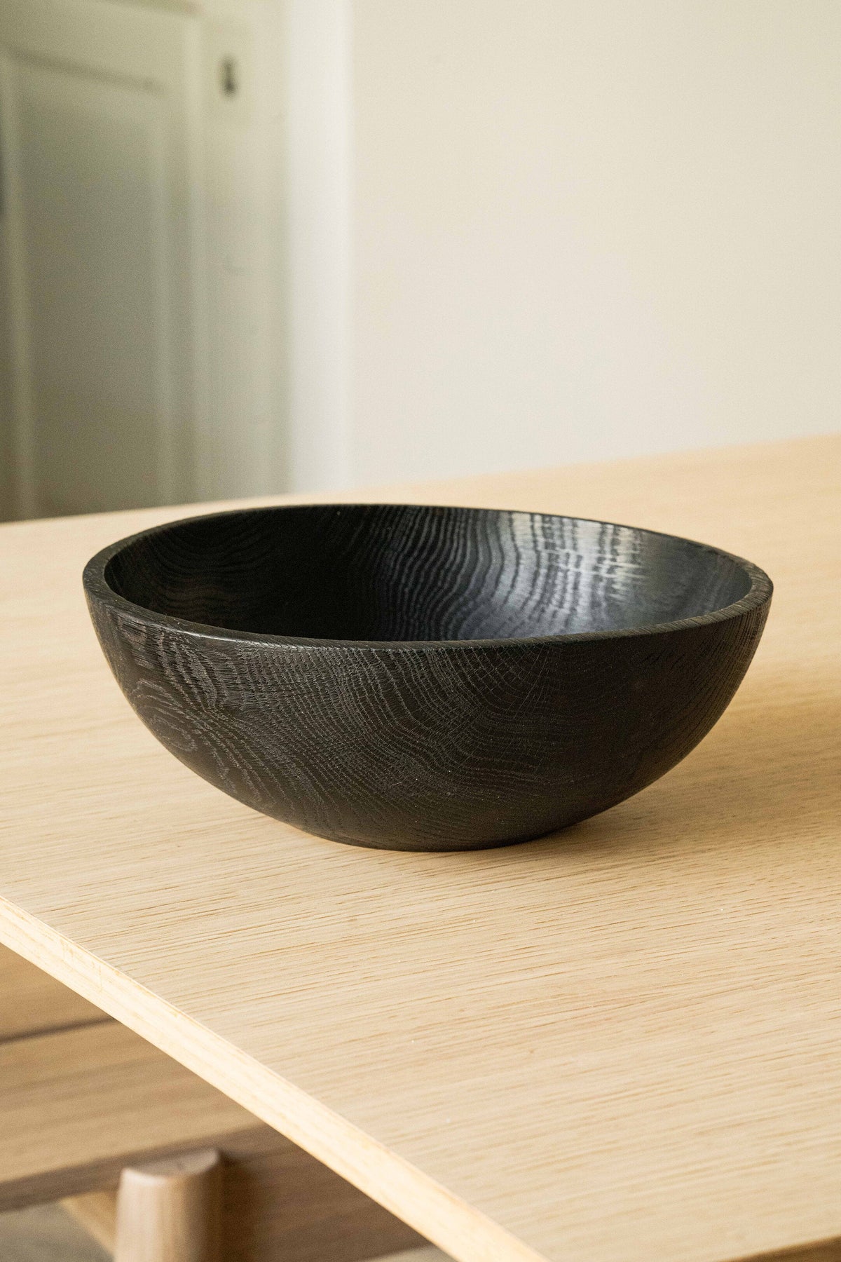 Hand-carved large charred wood bowl made from ash wood, finished with food-safe oil, perfect for fruits and vegetables.