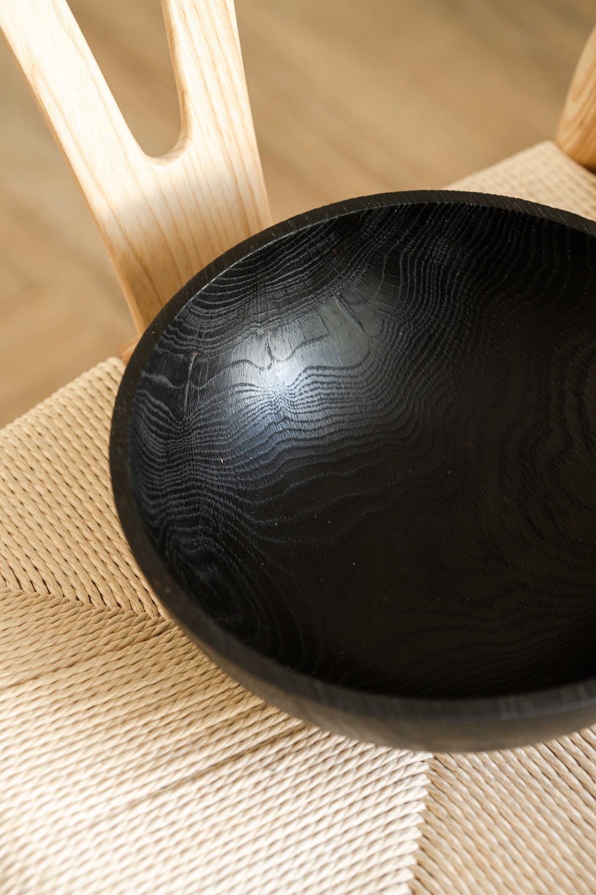 Hand-carved large charred ash wood bowl, food-safe finish, handmade in Ukraine, ideal for fruits and vegetables.