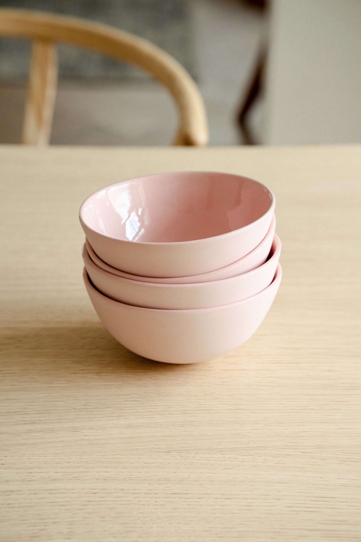 Handmade powder pink porcelain bowl with shiny glaze and smooth finish