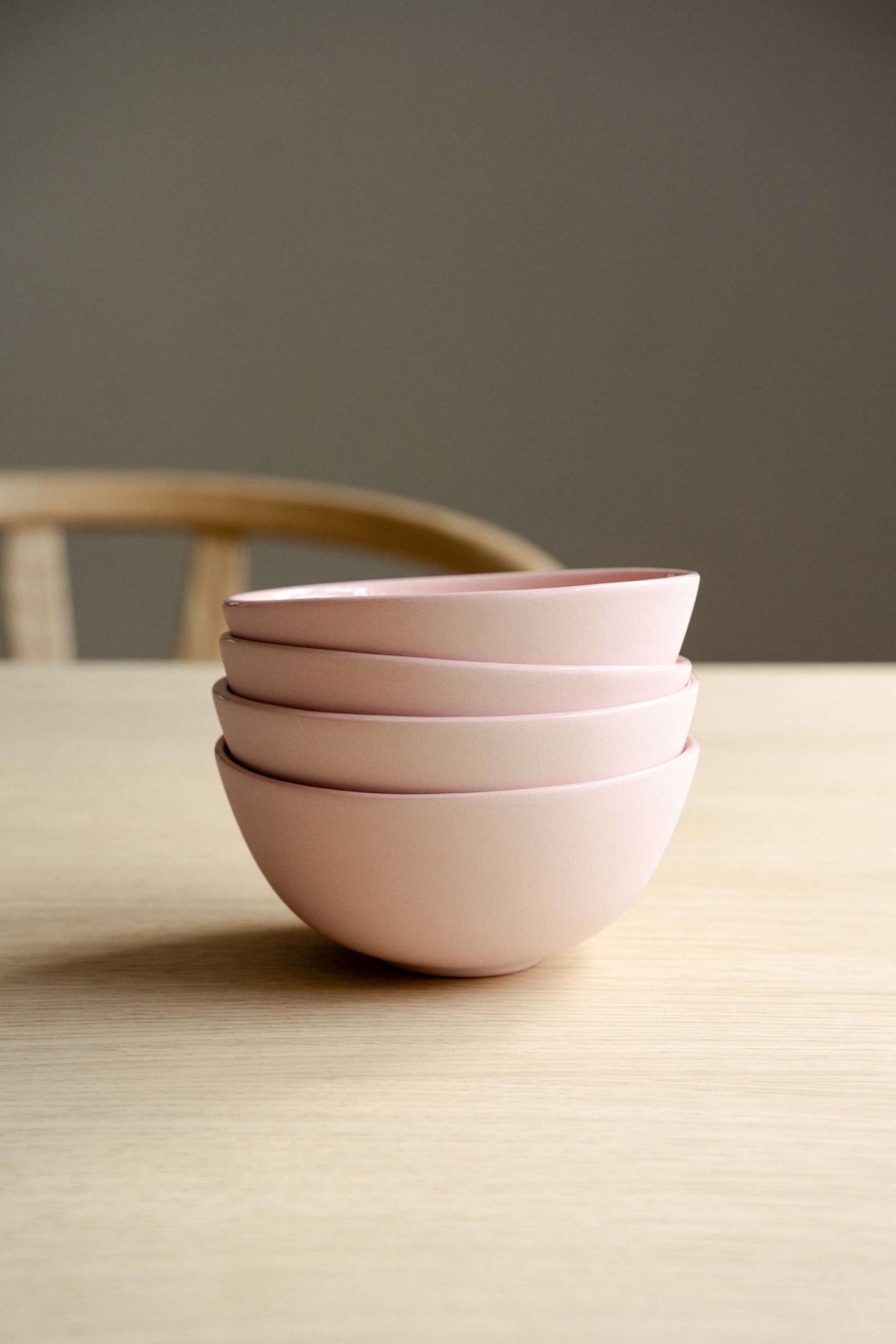 Handmade powder pink porcelain bowl with shiny glazed interior and smooth exterior, dishwasher safe