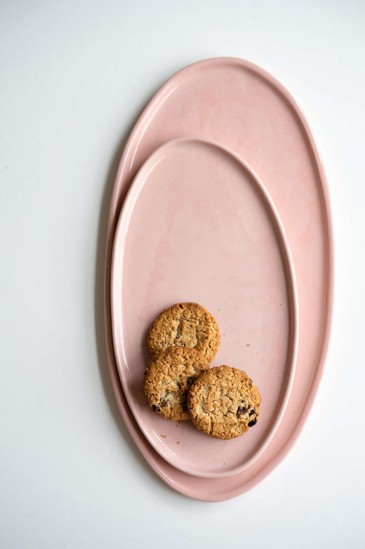Handmade porcelain oval platter in powder pink with organic edges, dishwasher safe, made in Ukraine