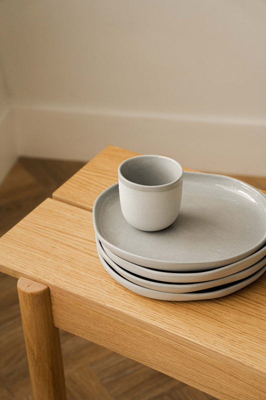 Handmade porcelain coffee cup in gray sky color with glossy glaze and smooth finish