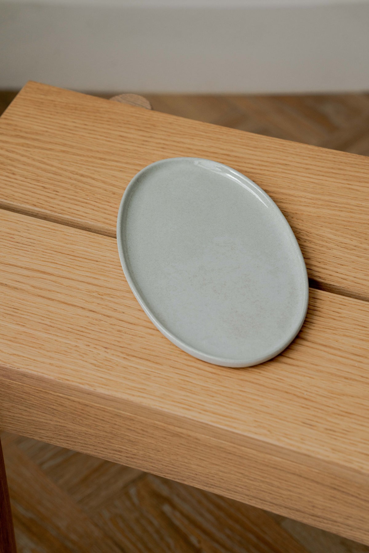 Handmade porcelain gray oval serving platter with organic edges for everyday use