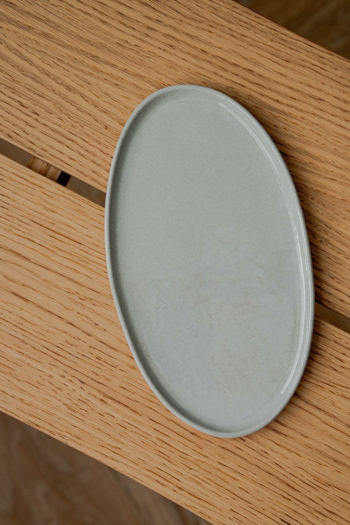 Handmade porcelain gray sky oval serving platter with organic edges